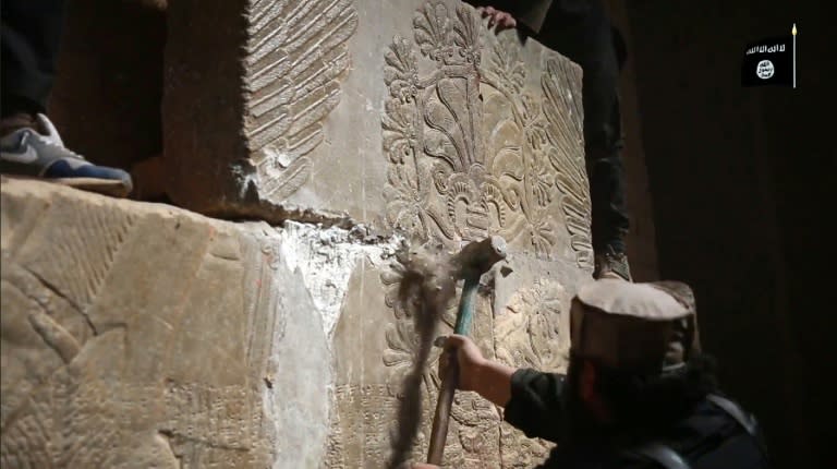 A Jihadist media outlet Welayat Nineveh image from on April 11, 2015, allegedly shows members of the Islamic State militants destroying a stoneslab with a sledgehammer in the ancient Assyrian city of Nimrud in northern Iraq