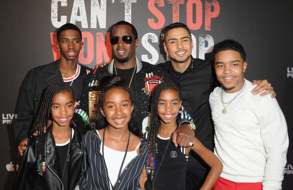 Diddy with his kids on the red carpet when they're younger