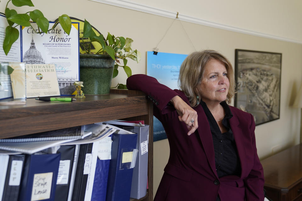 Sherry Williams, executive director of One Treasure Island, poses for a photo her office on Tuesday, April 5, 2022, in San Francisco. Business Email Compromise scams are a type of crime where criminals hack into email accounts, pretend to be someone they're not and fool victims into sending money to places they aren't supposed to. In the case of Williams, the San Francisco nonprofit director, thieves hacked the email account of the nonprofit's bookkeeper then inserted themselves into a long email thread, sent messages asking to change the wire payment instructions for a grant recipient, and made off with $650,000. (AP Photo/Eric Risberg)