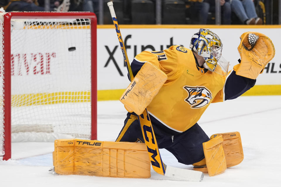 Nashville Predators goaltender Juuse Saros (74) lets a shot on goal by Colorado Avalanche center Nathan MacKinnon, not pictured, get past to score during the first period of an NHL hockey game Saturday, March 2, 2024, in Nashville, Tenn. (AP Photo/George Walker IV)