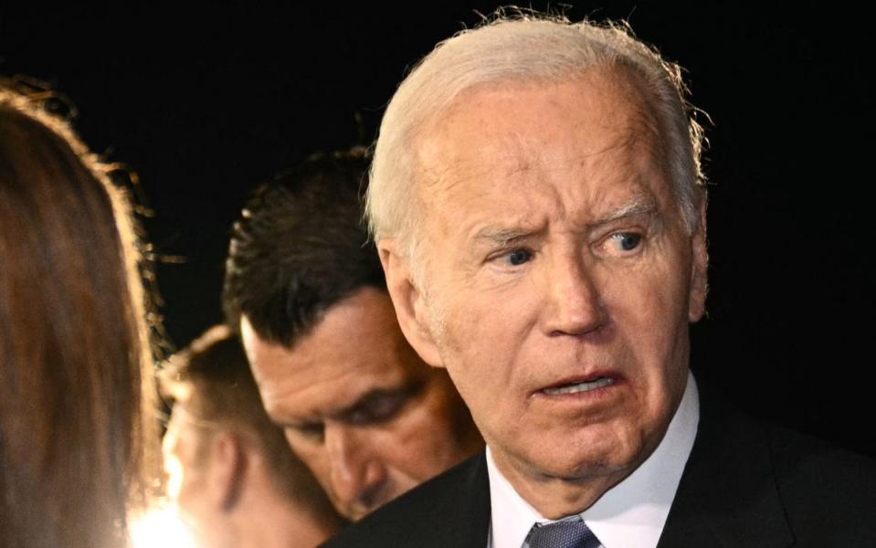 US President Joe Biden speaks to supporters gathered on the tarmac upon his arrival in North Carolina early on Friday