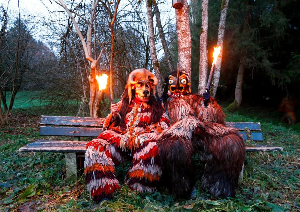 Costumed participants take break during Perchten parade