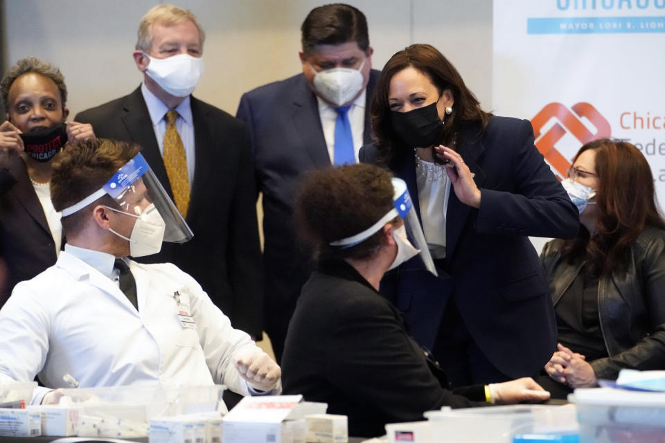 Vice President Kamala Harris speaks during visit to a COVID-19 vaccination site Tuesday, April 6, 2021, in Chicago. Listening are Chicago Mayor Lori Lightfoot, Sen. Dick Durbin, D-Ill., Illinois Gov. J.B. Pritkzer and Sen. Tammy Duckworth, D-Ill., right. The site is a partnership between the City of Chicago and the Chicago Federation of Labor. (AP Photo/Jacquelyn Martin)