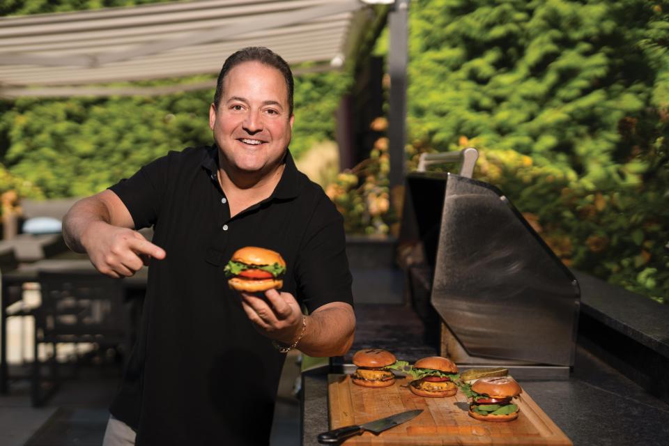 Celebrity chef Josh Capon grills cheeseburgers at his Tenafly home.