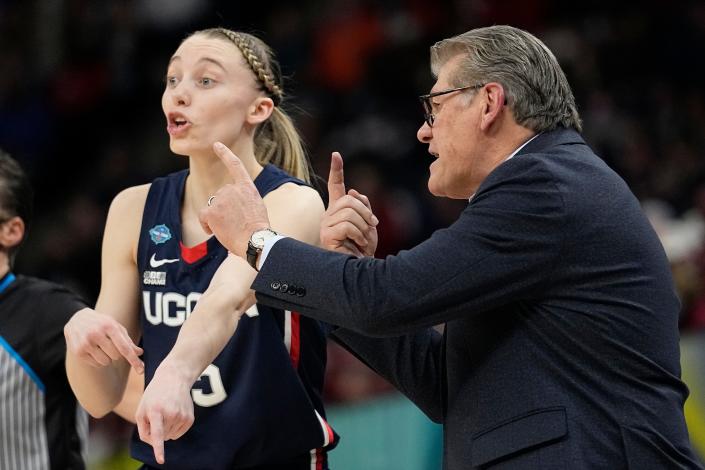 UConn head coach Geno Auriemma talks to Paige Bueckers during the Huskies' 63-58 semifinal round win against Stanford on Friday in Minneapolis. (AP Photo/Eric Gay)