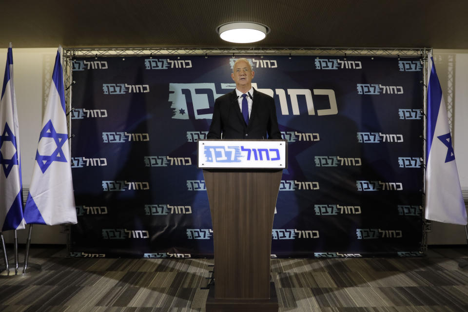 Blue and White party leader Benny Gantz delivers a statement in Tel Aviv, Thursday, Sept. 19, 2019. Benny Gantz's Blue and White has pledged not to sit in the same government as Netanyahu, as the long-serving Israeli leader is expected to face indictment in a slew of corruption scandals. (AP Photo/Sebastian Scheiner)