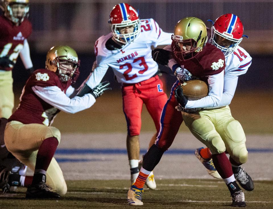 Linton-Stockton's Hunter Gennicks (14) takes down Mater Dei's Luke Kassenbrock (17) at the Mater Dei vs Linton-Stockton game at the Reitz Bowl in Evansville, Friday, Nov. 1, 2019. Wildcats won 44-20 over Linton-Stockton in the Class 2A Sectional 40 semifinals.