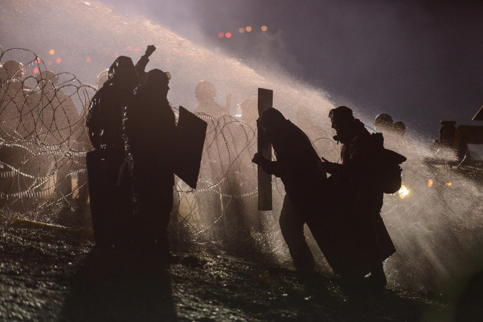 Police use a water cannon on protesters near the Standing Rock Indian Reservation.