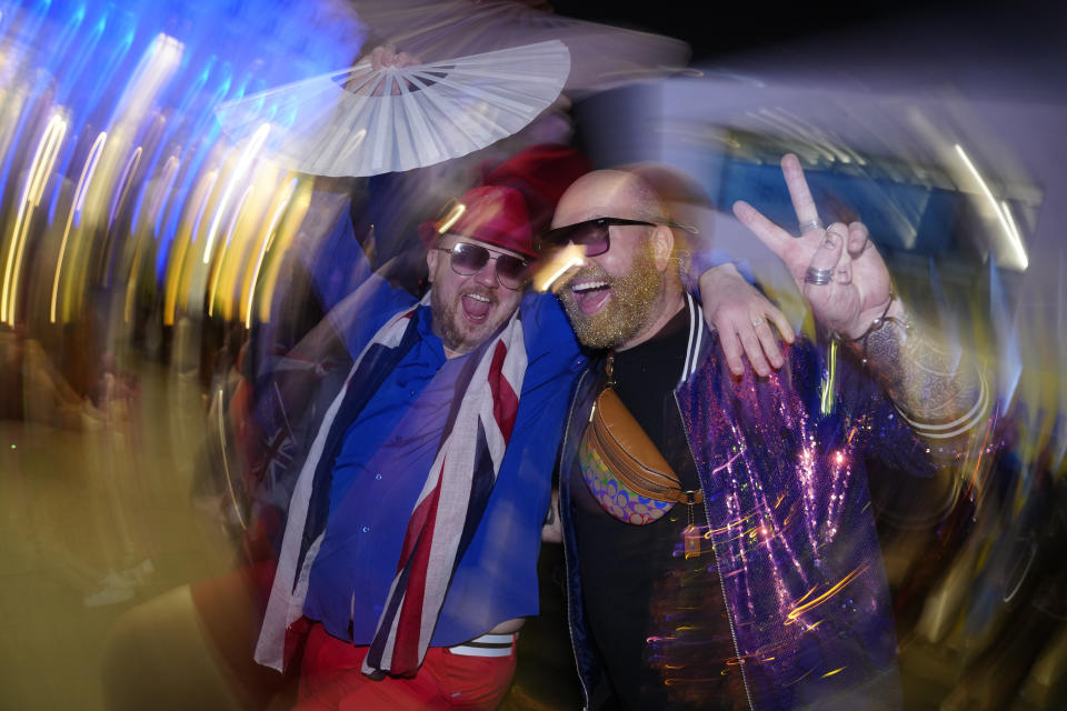 Fans enjoy the atmosphere in the Fan Zone outside the venue for the Grand Final of the Eurovision Song Contest in Liverpool, England, Saturday, May 13, 2023. (AP Photo/Jon Super)