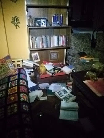 Books are seen on the ground inside of a house after an earthquake hit off the coast in Vina del Mar, Chile April 24, 2017 REUTERS/Stringer