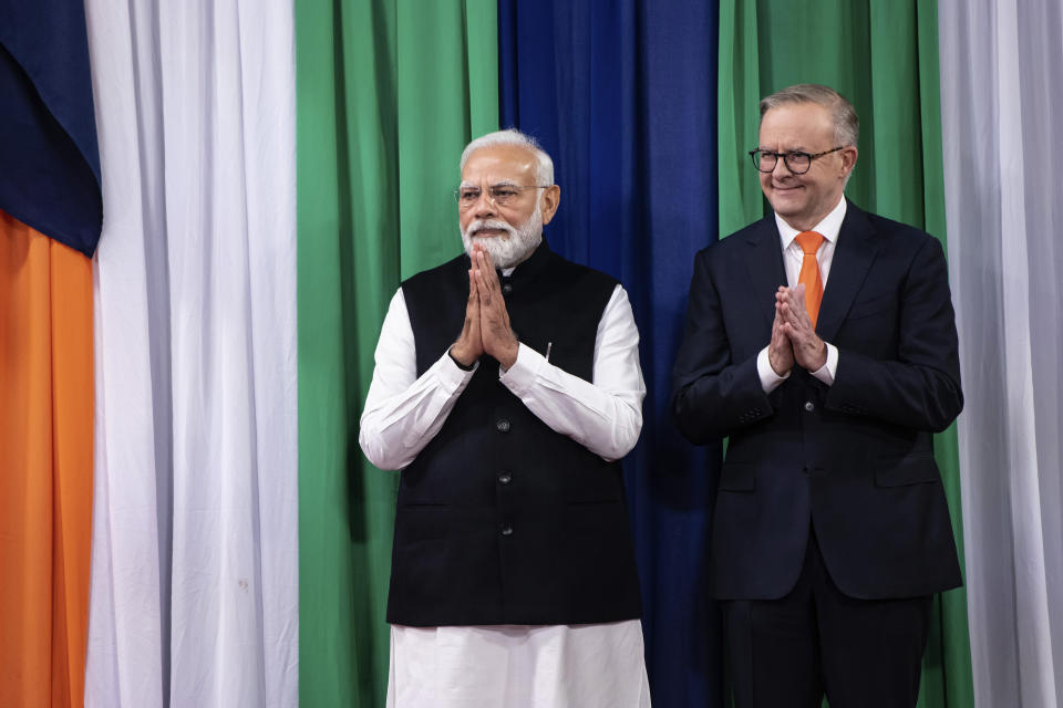 Indian Prime Minister Narendra Modi, left, and Australian Prime Minster Anthony Albanese arrive for an Indian community event in Sydney, Tuesday, May 23, 2023. Modi has arrived in Sydney for his second Australian visit as India's prime minister and told local media he wants closer bilateral defense and security ties as China's influence in the Indo-Pacific region grows. (Wolter Peeters/Pool Photo via AP)