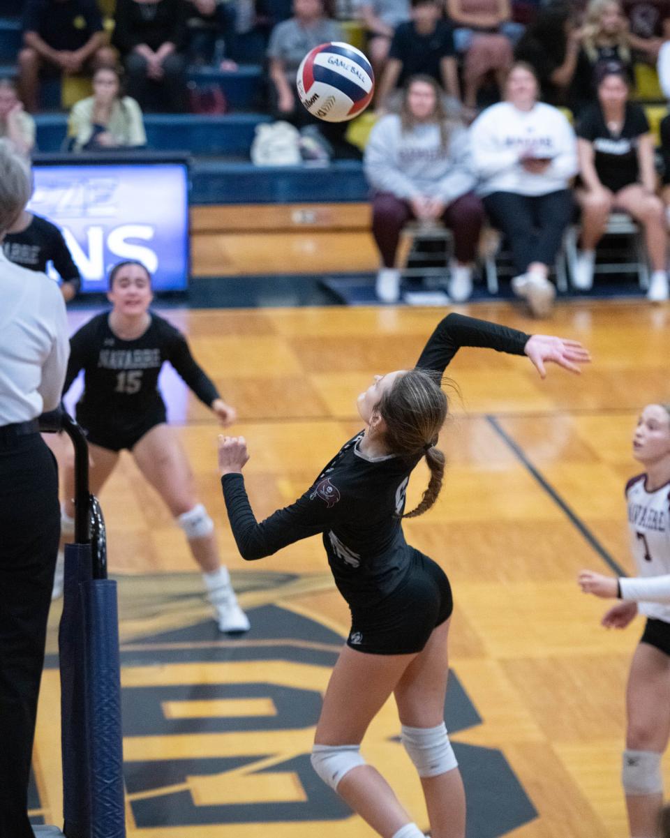 Layla Prochazka (6) plays the ball during the Navarre vs Gulf Breeze volleyball match at Gulf Breeze High School on Thursday, Sept. 28, 2023.