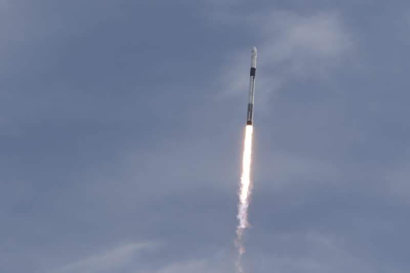 A SpaceX Falcon 9 rocket, carrying the Crew Dragon astronaut capsule, lifts off on an in-flight abort test from the Kennedy Space Center in Cape Canaveral