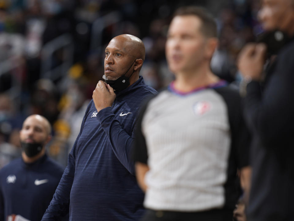 Denver Nuggets interim coach Popeye Jones watches during the first half of the team's NBA basketball game against the Sacramento Kings on Friday, Jan. 7, 2022, in Denver. (AP Photo/David Zalubowski)