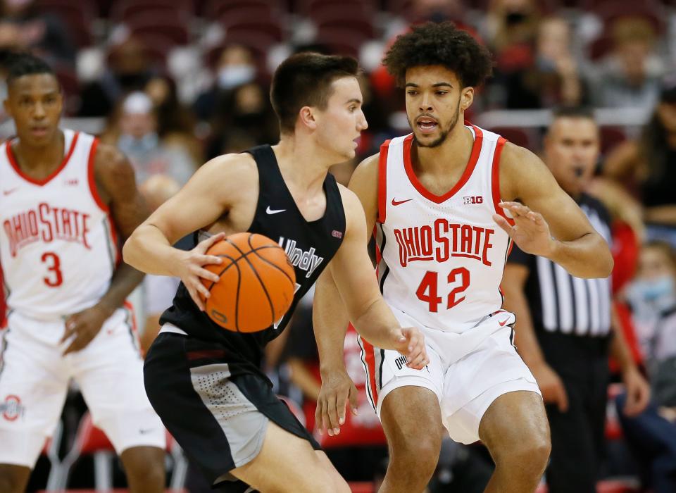 Ohio State Buckeyes forward Harrison Hookfin (42) guards Indianapolis Greyhounds guard Murray Beecher (14) during the second half of the NCAA exhibition basketball game at Value City Arena in Columbus on Monday, Nov. 1, 2021. 