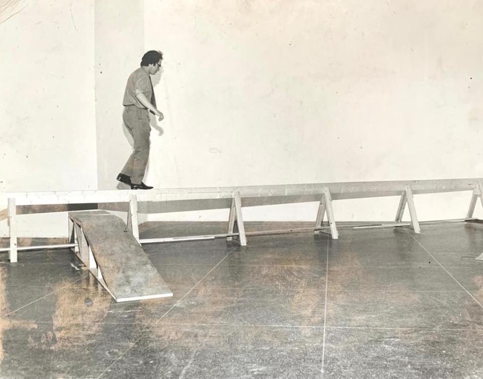 Balancing on a Robert Morris sculpture at the Tate in 1971; the exhibition was closed for health & safety reasons