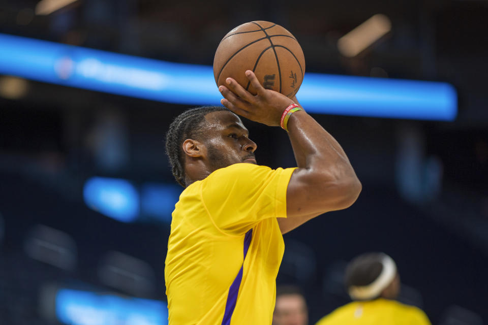 Los Angeles Lakers guard Bronny James warms up before an NBA summer league basketball game against the Sacramento Kings in San Francisco , Saturday, July 6, 2024. (AP Photo/Nic Coury)