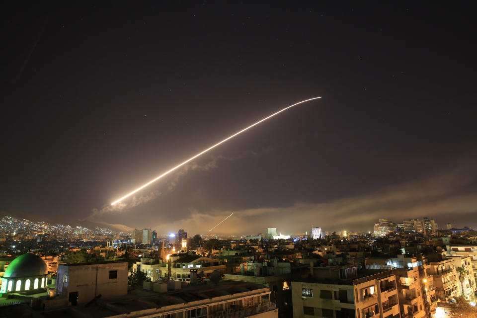 The Damascus sky lights up missile fire as the U.S. launches an attack on Syria targeting different parts of the capital early Saturday, April 14, 2018. (AP Photo/Hassan Ammar)