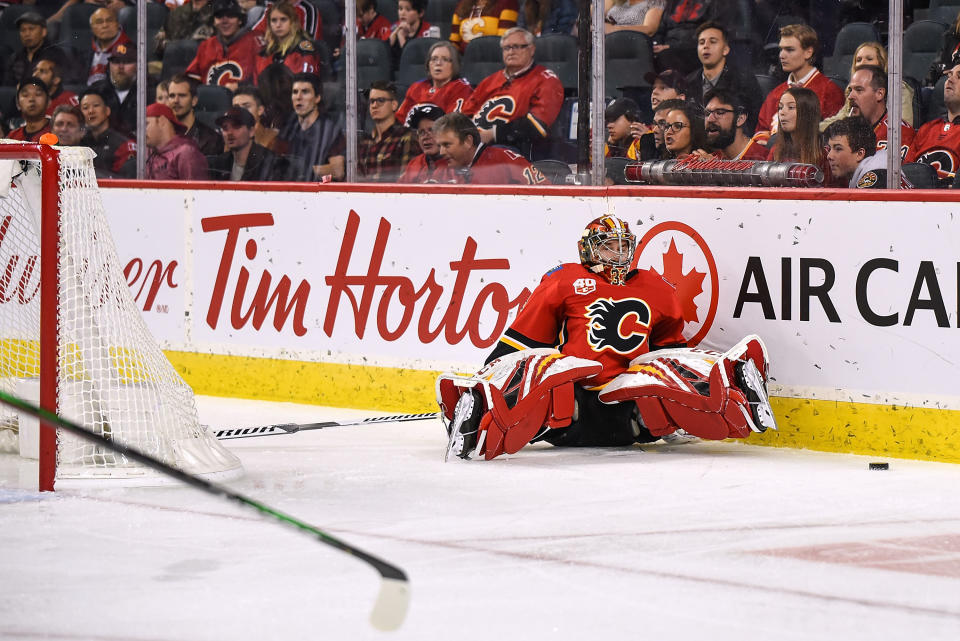 CALGARY, AB - OCTOBER 24: Calgary Flames Goalie David Rittich (33) stumbles behind his net while trying to play the puck during the second period of an NHL game where the Calgary Flames hosted the Florida Panthers on October 24, 2019, at the Scotiabank Saddledome in Calgary, AB. (Photo by Brett Holmes/Icon Sportswire via Getty Images)