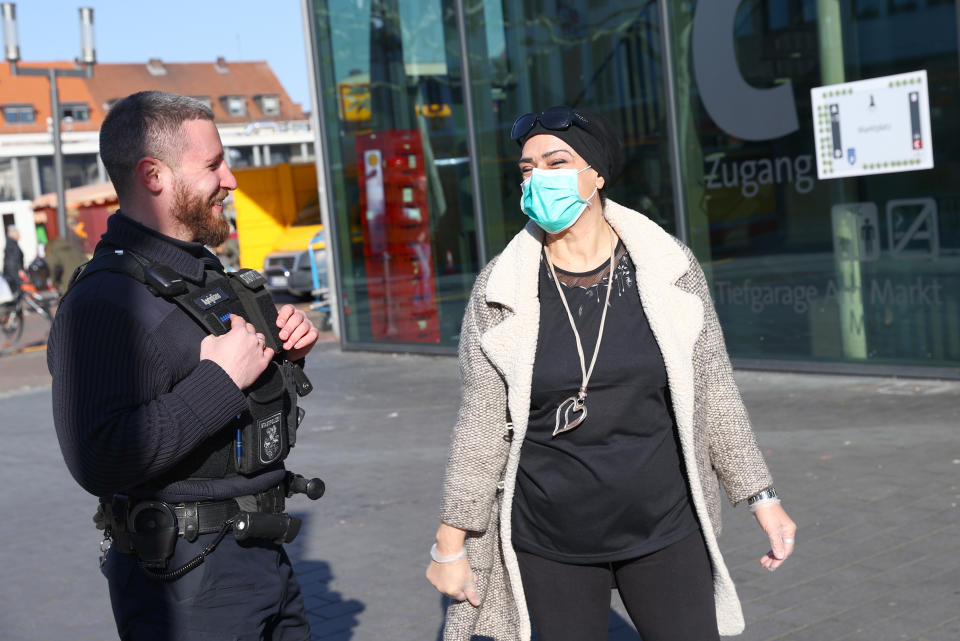 Marco Aprigliano of the City Police patrols to check opening permissions during a partial lockdown, as the spread of the coronavirus disease (COVID-19) continues, in Hanau, Germany, March 25, 2020. REUTERS/Kai Pfaffenbach