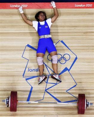 Thailand's Rattikan Gulnoi falls after failed attempt on the women's 58Kg Group A weightlifting competition at the London 2012 Olympic Games July 30, 2012.