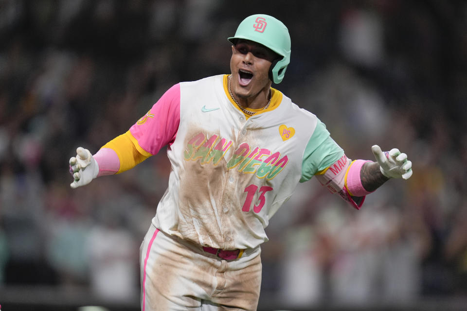 San Diego Padres' Manny Machado celebrates after hitting a game-winning two-run home run during the ninth inning of a baseball game against the Arizona Diamondbacks, Friday, July 5, 2024, in San Diego. The Padres won, 10-8. (AP Photo/Gregory Bull)