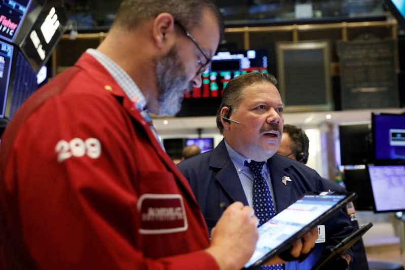 Traders work on the floor of the New York Stock Exchange shortly after the opening bell in New York City