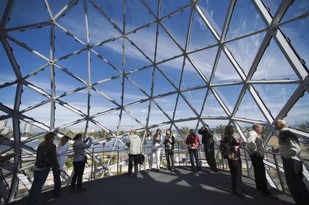 Visitors stand beneath a geodesic glass structure on the third floor after the grand opening and dedication for the new Dali Museum in St. Petersburg, Florida, in this January 11, 2011 file photo. REUTERS/Steve Nesius