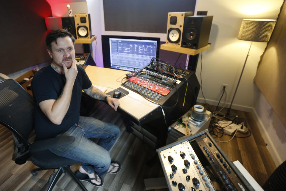In this Sept. 30, 2019 photo, Andreas Magnusson, a music producer who has been in the US for over 30 years, poses in his studio in Richmond, Va. Magnusson is among the oldest immigrants enrolled in Deferred Action for Childhood Arrivals, known as DACA. He came to the U.S. from Sweden when he was a toddler. His mother had a student visa and eventually found an employer who was sponsoring the two, but an immigration lawyer botched their case, and Magnusson, already an adult with a growing business, a home and a car, was left without legal status. (AP Photo/Steve Helber)