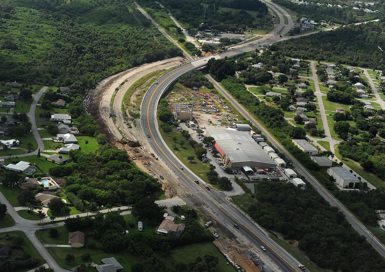 Looking south, two-way traffic flows across the new west span of the U.S. 1 bridge overpass above the Florida East Coast Railway track as construction crews prepare to reconstruct the east span on Wednesday October 1, 2014. The bridge connects St. Lucie County (top) to Indian River County.