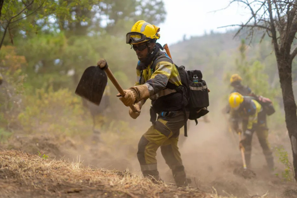 Agents of the Forest Fire Intervention and Reinforcement Teams (EIRIF) of the Government of the Canary Islands intervene in the La Palma fire on July 17, 2023, in La Palma, Canary Islands (Spain). The Forest Fire Intervention and Reinforcement Teams (EIRIF) of the Government of the Canary Islands have been working on the La Palma fire creating fire breaks. JULY 18;2023 Europa Press 07/17/2023 (Europa Press via AP)