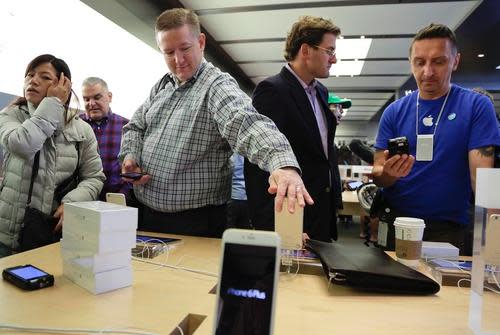 Customers in an Apple Store