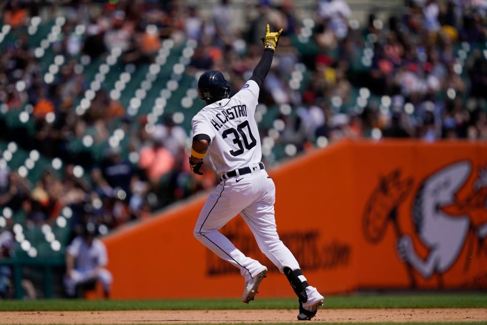 Tigers' Harold Castro signals as he rounds the bases after a solo home run during the fourth inning against the Guardians, Sunday, May 29, 2022, in Detroit.