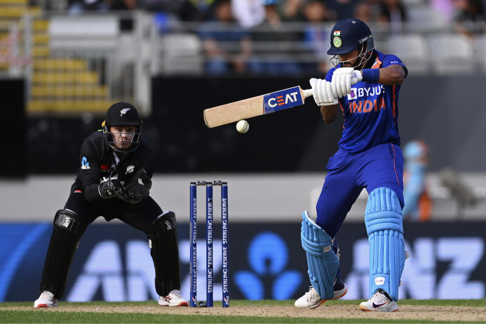 India's Shreyas Iyer, right, bats against New Zealand during their one day international cricket match in Auckland, New Zealand, Friday, Nov. 25, 2022. (Andrew Cornaga/Photosport via AP)