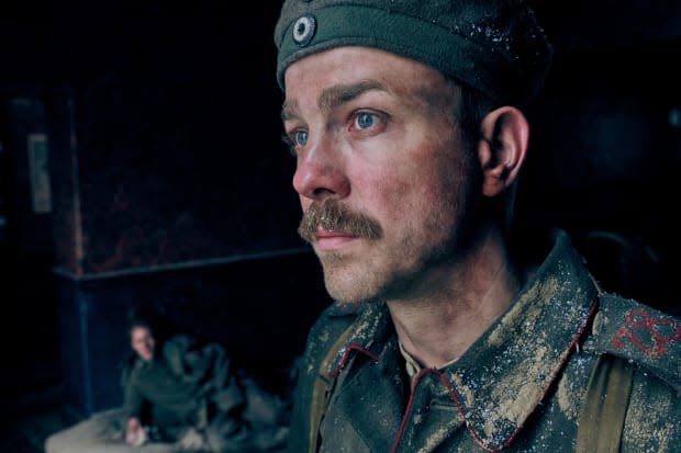 Albrecht Schuch as Stanislaus Katczinsky stands in front of Felix Kammerer as Paul Baumer in Netflix's "All Quiet on the Western Front" (2022)<p>Reiner Bajo/Netflix</p>