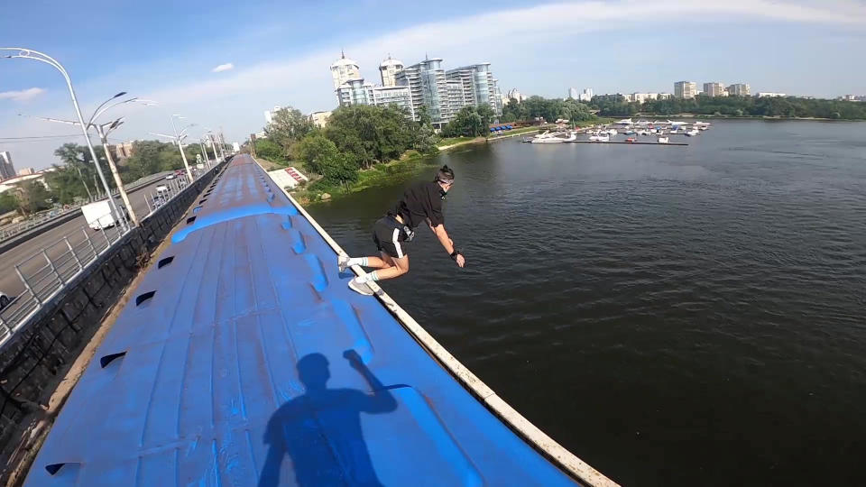 This heart-stopping footage shows a daredevil jumping from a speeding train into a river below. Yaro Panchenko, 18, is seen 'surfing' the subway car as it moves through his home town of Kiev in the Ukraine on August 1 this year. Not content with just surfing the train, Yaro then leaps from the carriage as it crosses a bridge into the water below. However, it didn't go entirely to plan as his Go Pro camera hit him in the face on impact and knocked out a tooth.