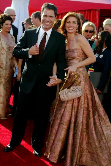 Actors Eric McCormack and Debra Messing attend the 55th Primetime Emmy Awards at the Shrine Auditorium September 21, 2003