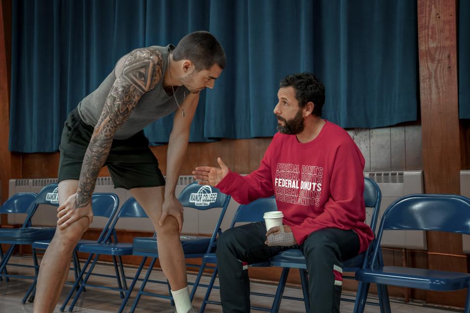 NBA scout Stanley Sugerman (Adam Sandler, right) prepares Spanish streetball star Bo Cruz (Juancho Hernangomez) for a chance at the pros in Netflix's "Hustle."