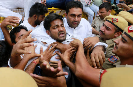 Supporters of India's main opposition Congress party scuffle with police during a protest demanding the resignation of India's Minister of State for External Affairs Mobashar Jawed Akbar in New Delhi, India, October 15, 2018. REUTERS/Adnan Abidi