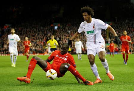 Football Soccer - Liverpool v FC Augsburg - UEFA Europa League Round of 32 Second Leg - Anfield, Liverpool, England - 25/2/16 Liverpool's Mamadou Sakho in action with Augsburg's Caiuby Action Images via Reuters / Carl Recine Livepic EDITORIAL USE ONLY.