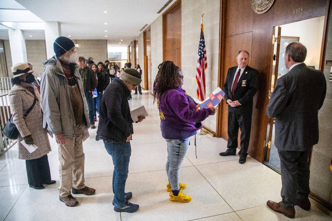 Voting rights activists wait in line to deliver letters outside House Speaker Tim Moore’s office at the NC Legislative Building Tuesday, March 14, 2022 as as the NC Supreme Court revisited the question of whether partisan gerrymandering is forbidden under the state constitution.