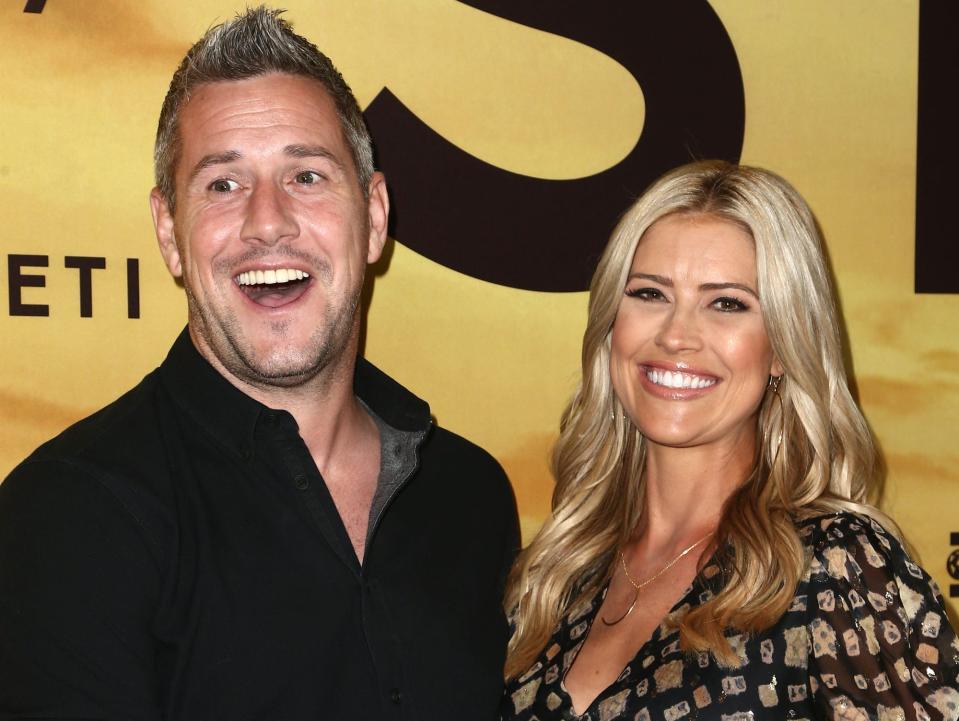 Ant Anstead holds Christina Haack's baby bump.