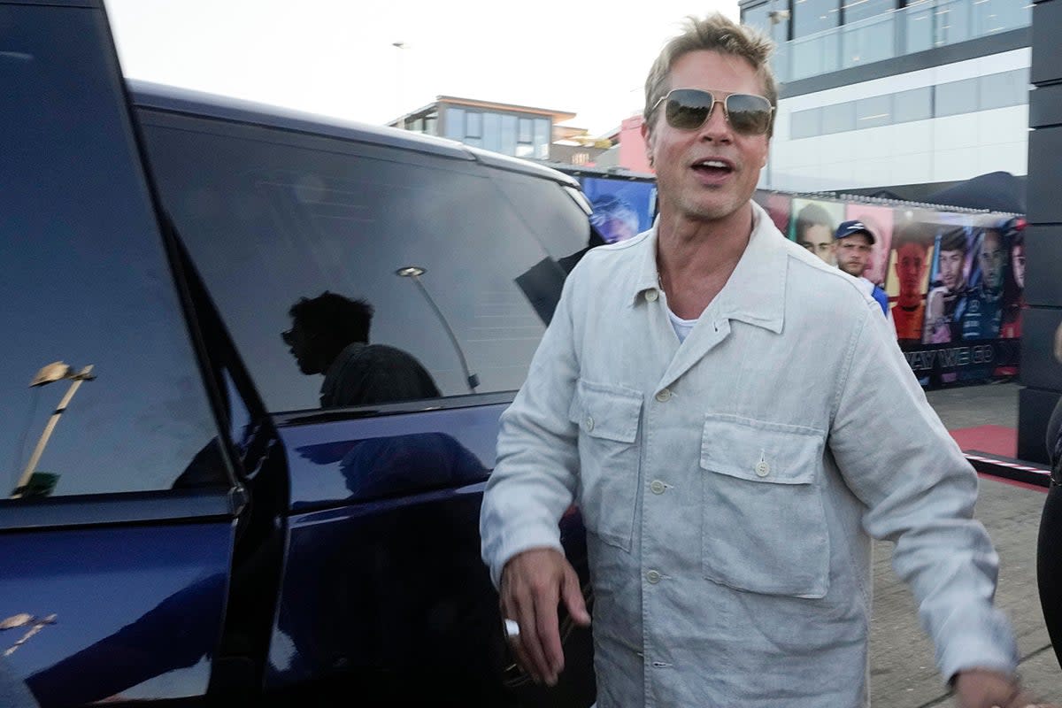 Brad Pitt cheers fans at Silverstone paddock ahead of British Grand Prix (Luca Bruno/PA) (AP)