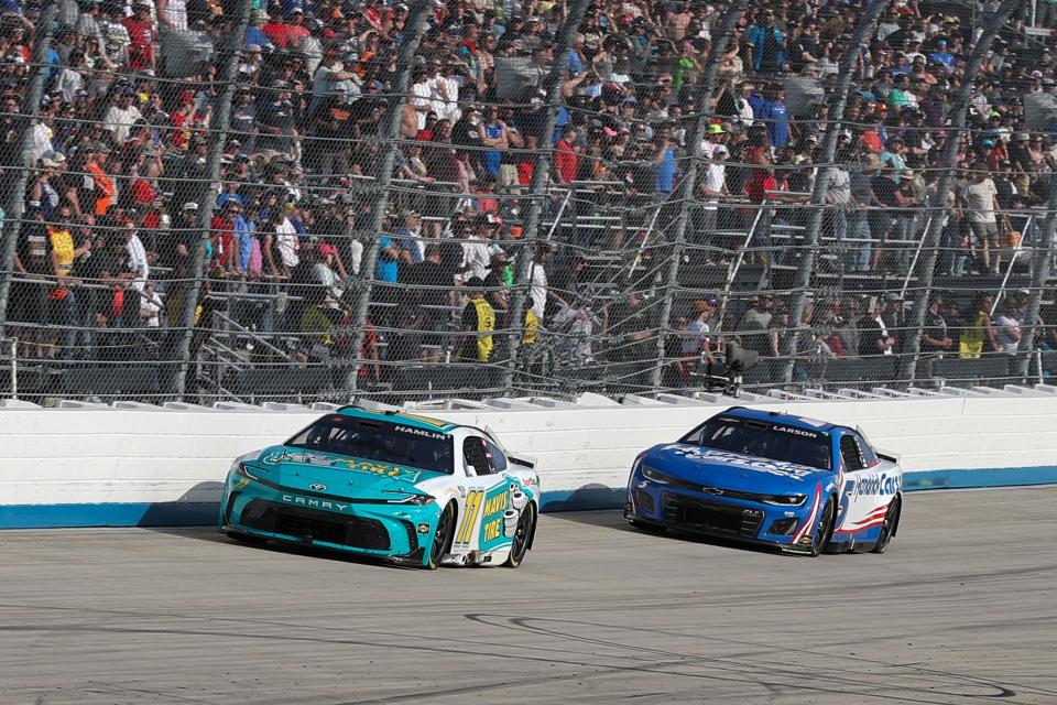 Denny Hamlin (11) was able to aero block Kyle Larson (5) over the final laps at Dover on Sunday.