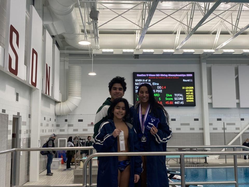 HAC's Elina Natarajan (right) won her third Section V Class D diving champion Saturday at Addison Central. Kiran Natarajan (back left) was the runner-up. Kavin Natarajan placed fourth.