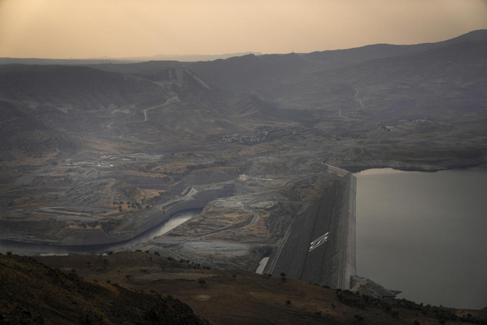 A general view of the Ilisu Dam reservoir is seen in Mardin province, Turkey, Tuesday, Oct. 18, 2022. Before Turkey began operating the dam in May 2020, all the waters of Tigris River flowed into Iraq. Now how much water comes down depends on Ankara's consideration of Iraq's month-to-month requests for a minimum flow, weighed against Turkey's own needs. (AP Photo/Khalil Hamra)