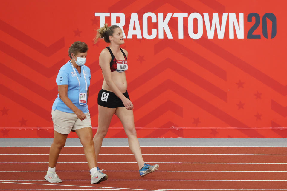 Lindsay Flach (pictured right) walks from the track after dropping out of the Women's Heptathlon 800 Meters during day ten of the 2020 US Olympic Track & Field Team Trials.