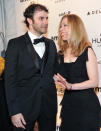 FILE- In this Feb. 9, 2011 file photo, Chelsea Clinton and husband Marc Mezvinsky attend amfAR's annual New York Gala at Cipriani Wall Street, in New York. Clinton announced that she is pregnant with the couple’s first child on Thursday, April 17, 2014, while co-hosting “Girls: A No Ceilings Conversation,” a Clinton Foundation event in New York. Former Secretary of State Hillary Rodham Clinton co-hosted the event with her. (AP Photo/Evan Agostini, File)