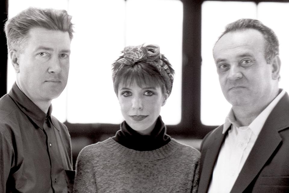 Portrait (from left to right) of David Lynch film and television director, Angelo Badalamenti composer and Julee Cruise singer on the rooftop of a West 34th street hotel in New York City, New York, October 25th, 1989. The photo was taken for the Village Voice.