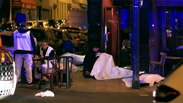 Victims lay on the pavement in a Paris restaurant. Photo: AP/Thibault Camus